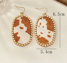 Load image into Gallery viewer, Oval cow print earrings